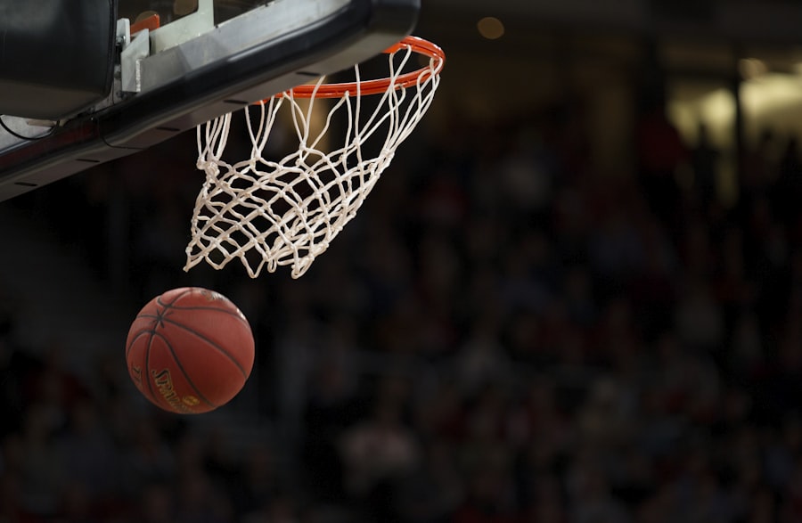 Basketball dropping through an arena hoop